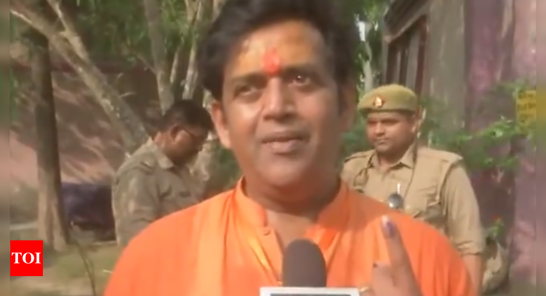 'We are not VIP's..' Gorakhpur BJP candidate Ravi Kishan queues up to cast his vote | India News - Times of India